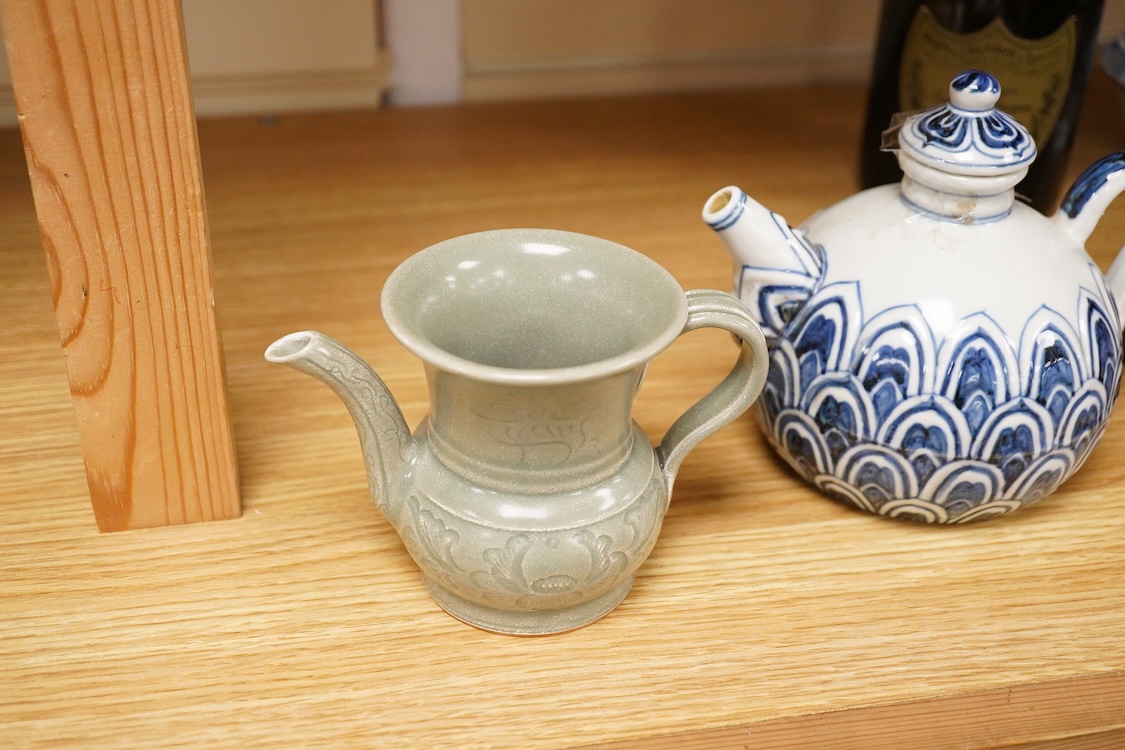 A Chinese blue and white teapot and cover, Xuande mark but later and a Chinese celadon glazed jug, tallest 13.5cm